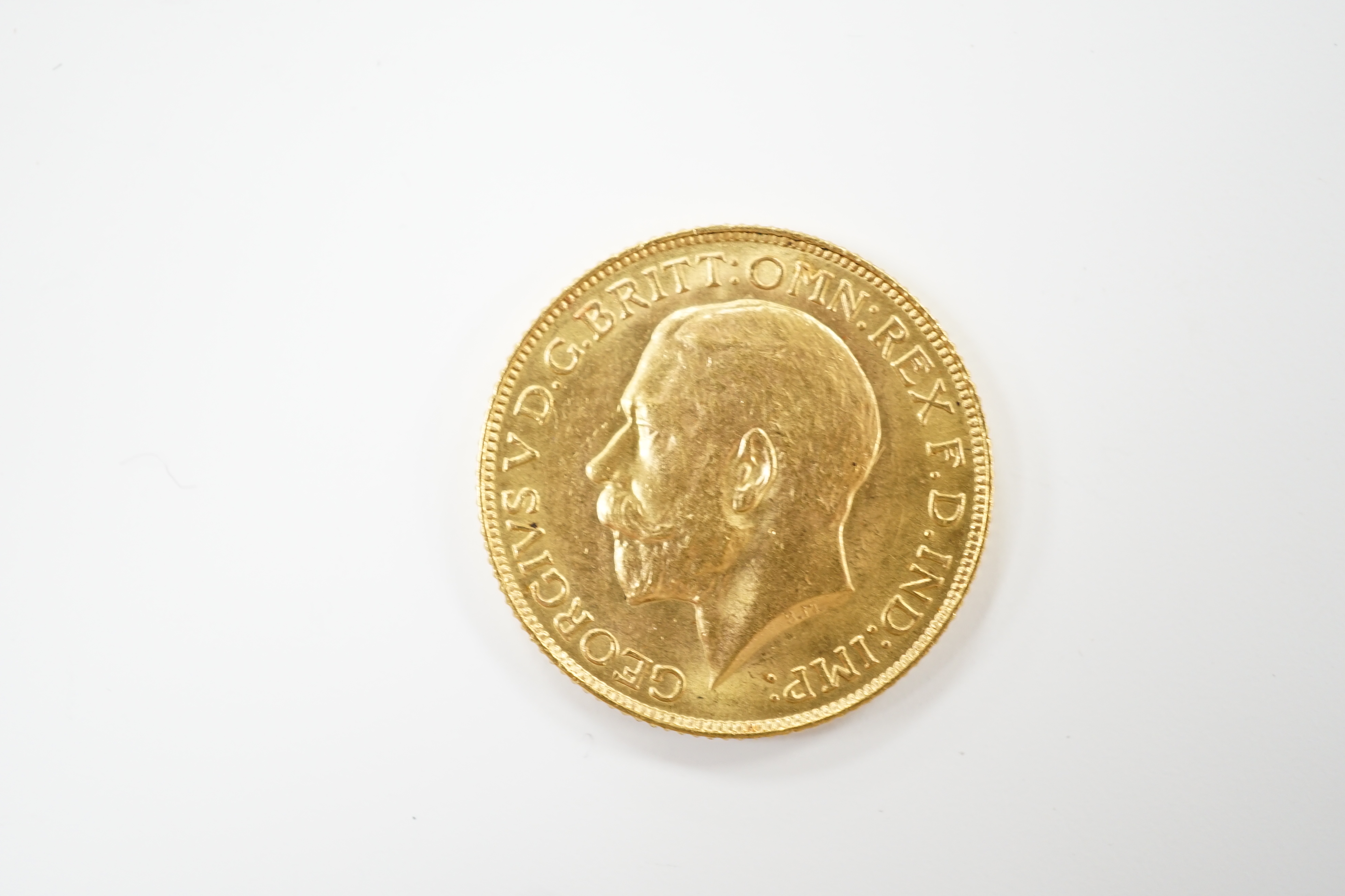 A George V 1925 gold sovereign.